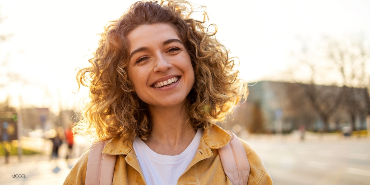 Young Woman Smiling Outdoors